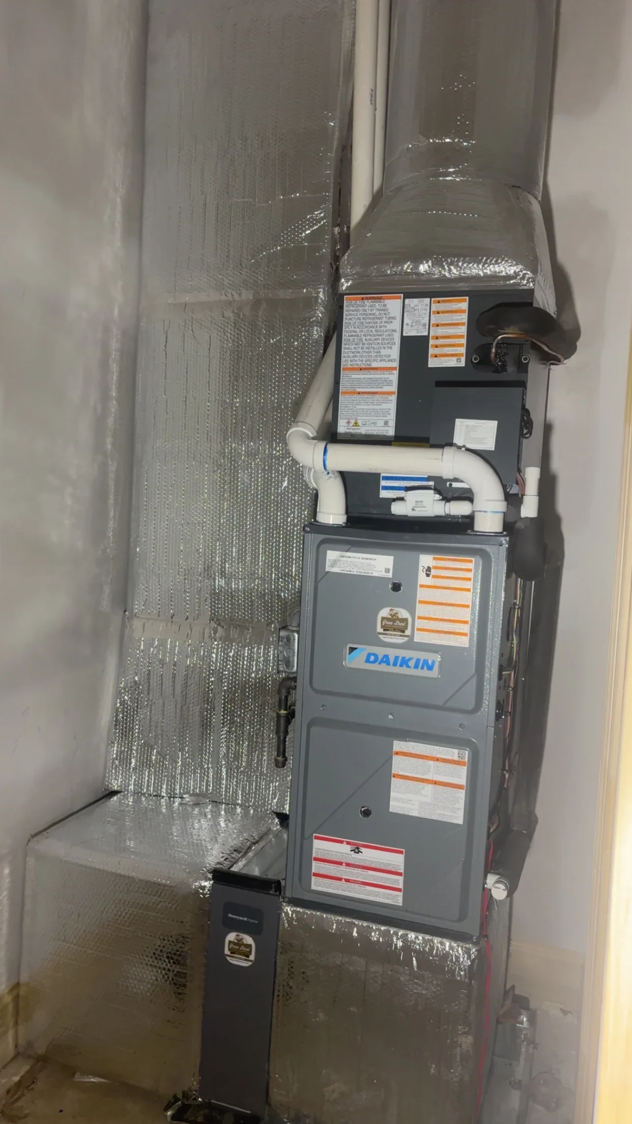 Daikin furnace with insulated ductwork and PVC piping installation